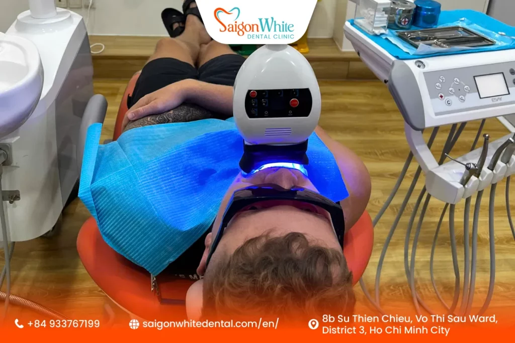 A patient gets teeth whitening at Saigon White Dental Clinic.