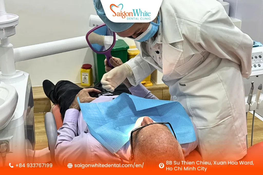 A Patient is getting a teeth cleaning at Saigon White Dental