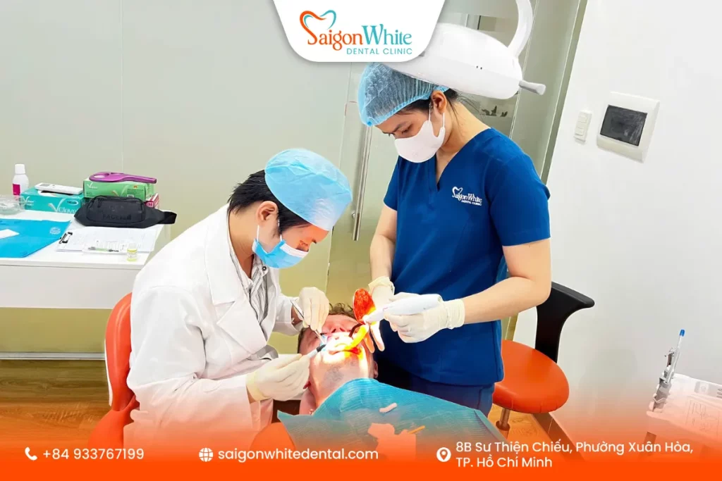 The customer is getting a teeth whitening treatment at Saigon White Dental Clinic